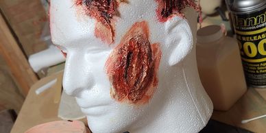 Liquid latex, cotton, shaped dried, painted with latex and acrylic paint mix.