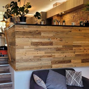 Wooden cladding fitted in this living room.