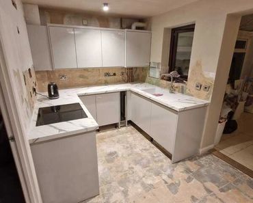 Kitchen installation before tiling and flooring.