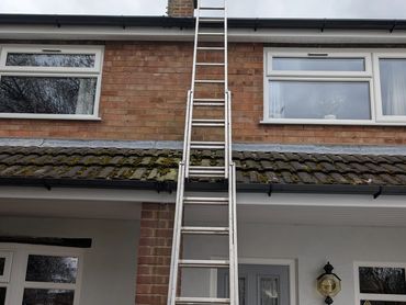 This is a ladder up to the first floor gutters to carry out a repair to a leaking gutter.