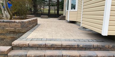 Beige paver steps, patio, and retaining wall/ planter box installed in port monmouth nj