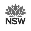 NSW Government logo with red waratah flower above bold blue “NSW” text.