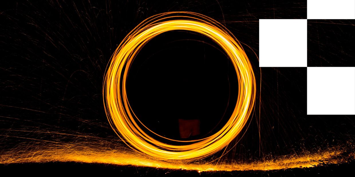 Ring of golden-orange light blazes against a black background, creating a hypnotic radiating circle
