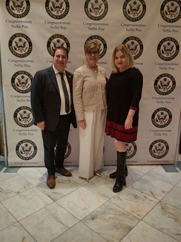 Young professionals in business wear enjoying a conversation at a networking reception