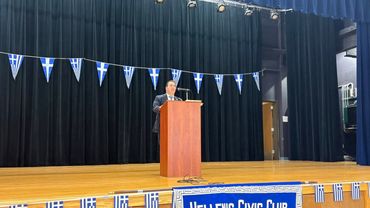 A man giving speech on a stage