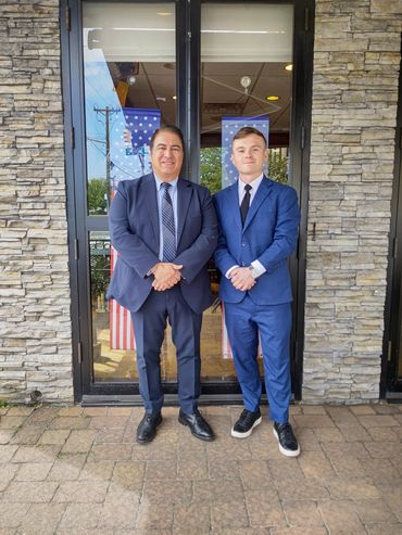 Panel of business professionals seated on stage at an industry conference