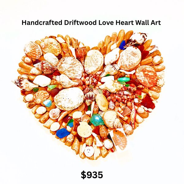 Handcrafted driftwood and shell heart wall art priced at $935.