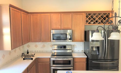 before picture of kitchen cabinet by RepaintFlorida.com in lake nona area of orlando fl 32827