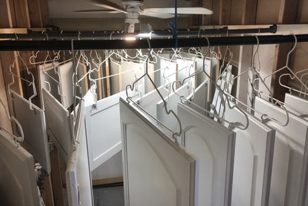 spray paint kitchen doors orlando fl by Repaint Florida LLC