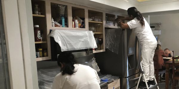Repaint Florida crew refinishing & painting kitchen cabinets in Merritt Island Fl 32952