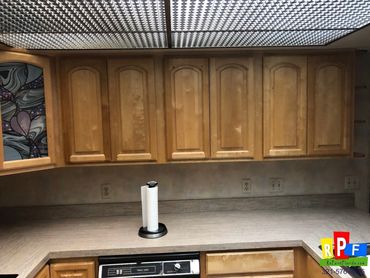 before picture of kitchen cabinets being painted white