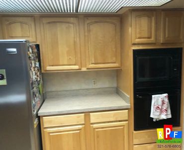 before picture of cabinets being painted white
