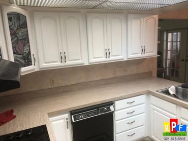Here's the after picture of kitchen cabinets painted white in Apopka Fl 32703