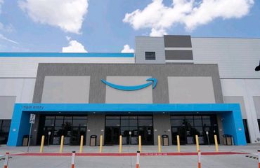 Front view of an Amazon warehouse building with main entry.