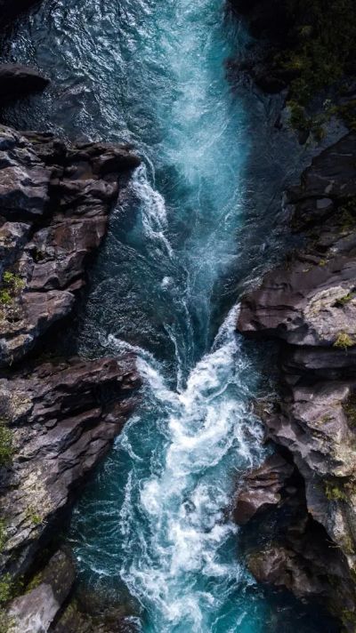 A river rushing through rocky cliffs.