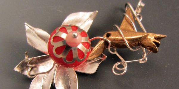 Finished jewelry with handmade sterling silver leaves and bronze hummingbird