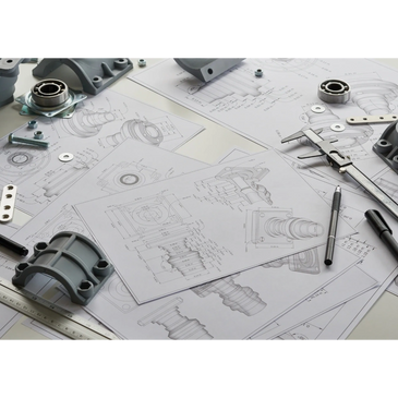 Mechanical parts and tools on detailed engineering blueprints.
