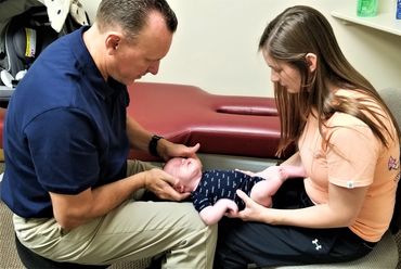 Dr. Bailey adjusting 7 week old