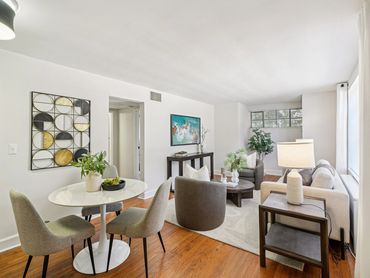 Modern living room with neutral tones and cozy seating.