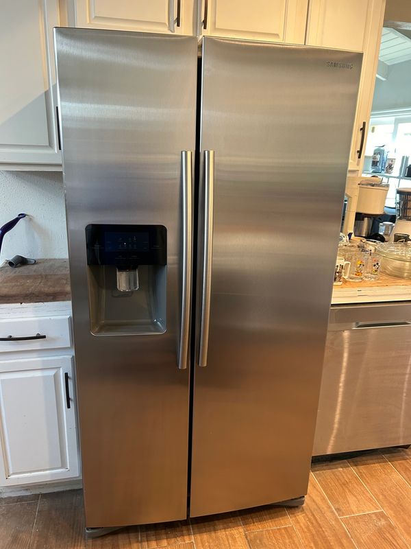 A stainless steel refrigerator for sale from an estate sale in Pomona Valley