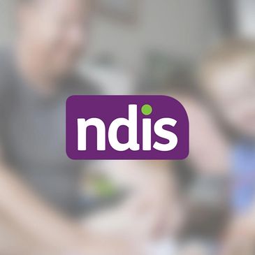 NDIS logo over blurred background of people interacting.