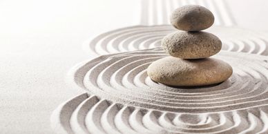 3 stacked rocks in zen garden