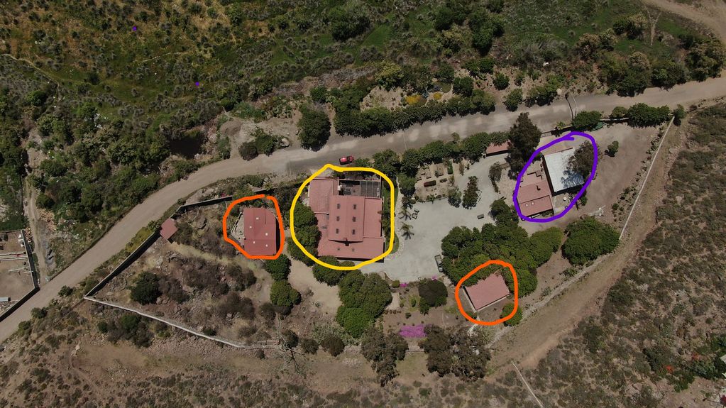 The Main house is circled in yellow. The guest house is circled in orange. The surgery barn and offi