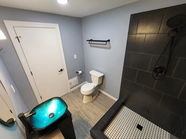 Carmel, IN basement bathroom remodel with custom cabinet and tile