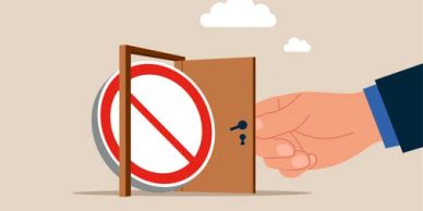 A hand opens a door revealing a no-entry sign inside.