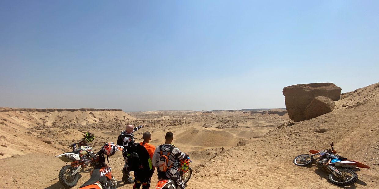 Dirt bike riders on an extreme KTM desert adventure motocross enduro ride in Egypt
