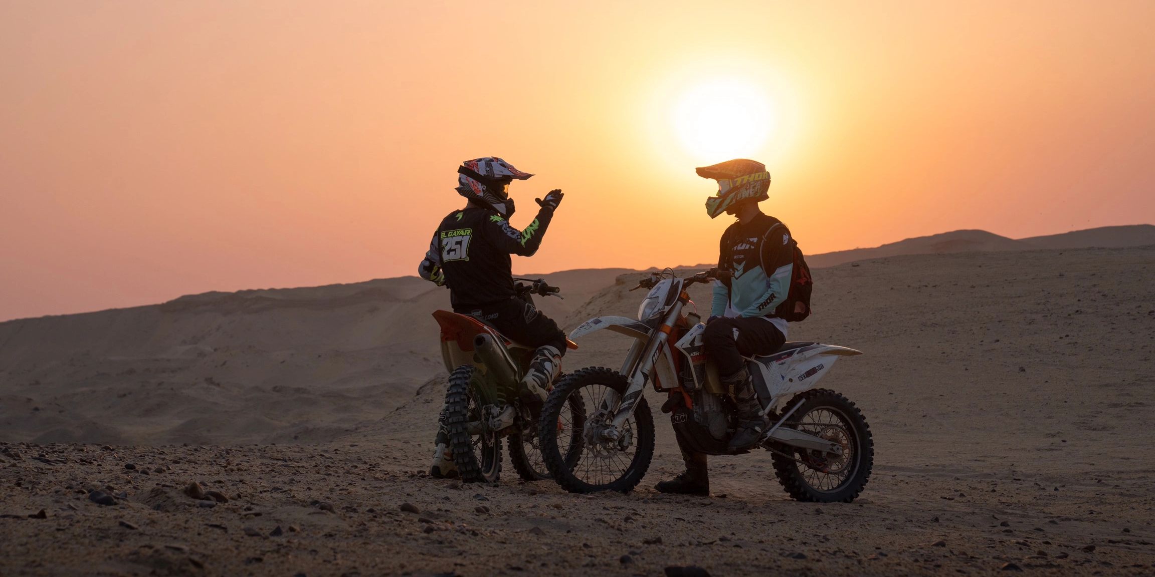 Dirt bike riders on an extreme KTM desert adventure motocross enduro ride in Egypt