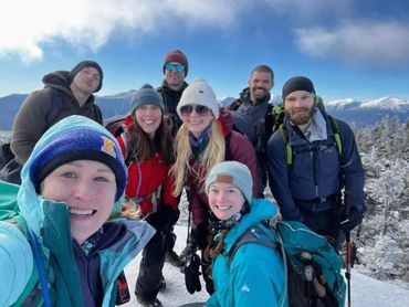 A group of people on a mountain covered with snow