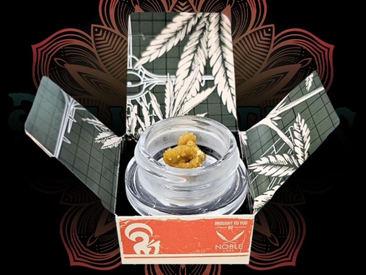 Cannabis concentrate in a branded container.