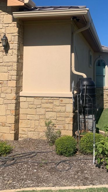 “6 gutters with 3x4 downspouts hooked up to a rain barrel