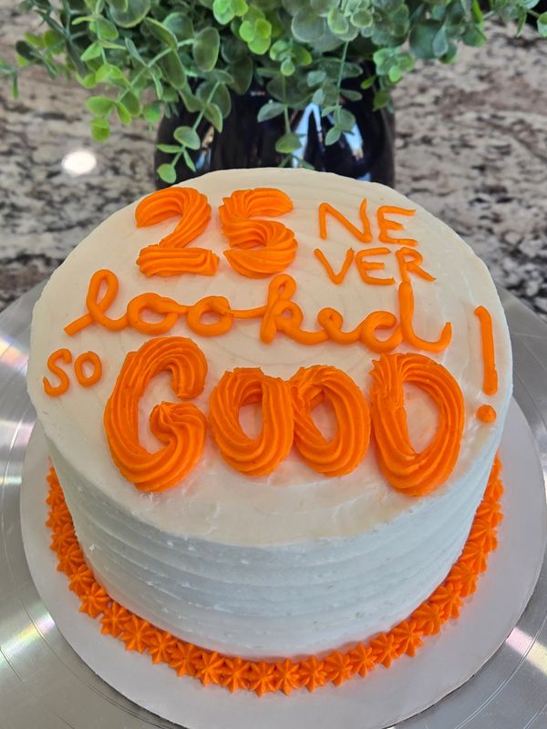 6-inch (3 layer) cake, vanilla textured frosting, star tip and small round tip writing in orange, st