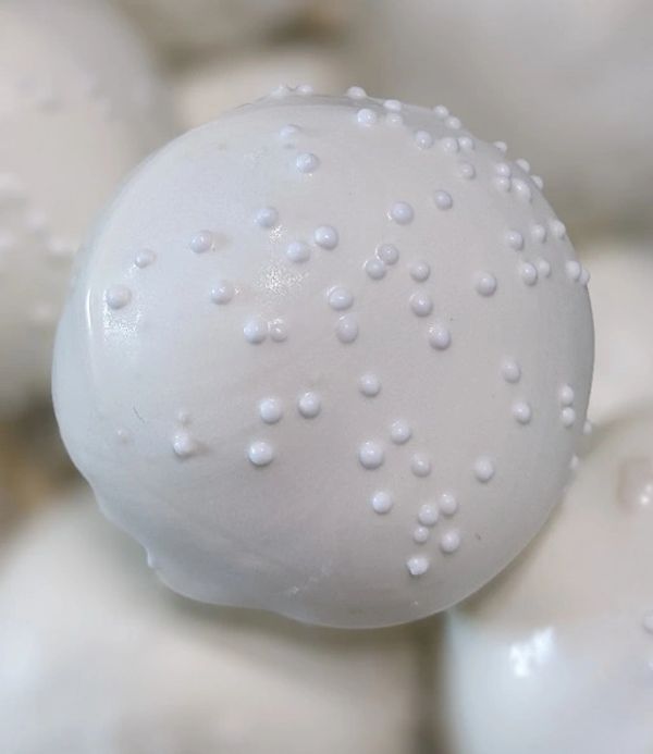 Vanilla cake pop, vanilla candy coating, white nonpareils