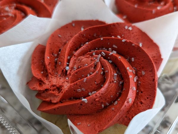 Vanilla cupcakes, red frosting, silver crystals