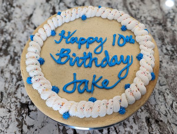 Giant sugar cookie, vanilla frosting, rainbow nonpareils