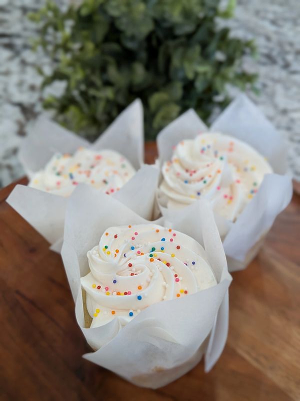 Vanilla cupcakes, vanilla frosting, rainbow nonpareils