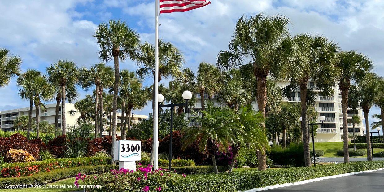 3360 S Ocean, Palm Beach, building with flag and flowers