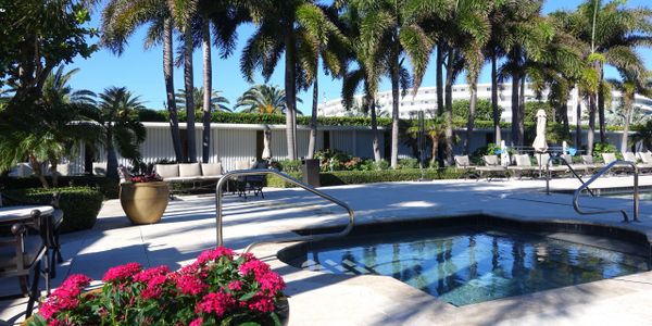 2500 Building, 2500 South Ocean Blvd, Palm Beach, pool with cabanas and flowers 
