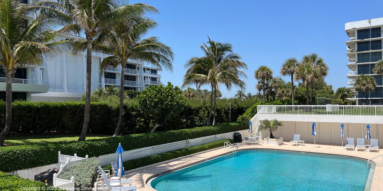 Palm Beach Stratford pool deck with blue umbrellas, 2580 S Ocean, Palm Beach