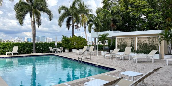 Poolside at Lake Towers, Palm Beach, loungers, cityscape