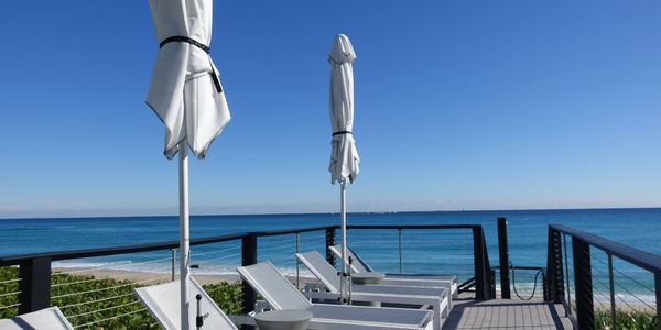 3120 Building, Palm Beach, view of the sundeck, ocean, chairs and umbrellas, condos for sale