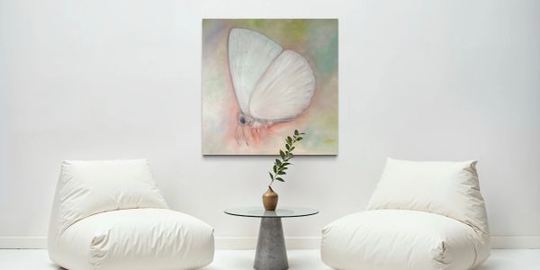 painting of a white butterfly on a wall