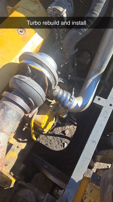 Newly rebuilt turbo installed on heavy machinery engine.