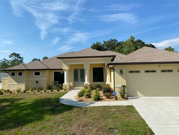 Brown seamless gutters installed on a house in sugar mill woods. Citrus county