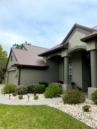 Brown seamless gutters installed on a house in sugar mill woods. Citrus county