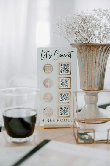 Hines Homes Let's Connect social media QR code sign - follow Delia Hines REALTOR® on Instagram Faceb