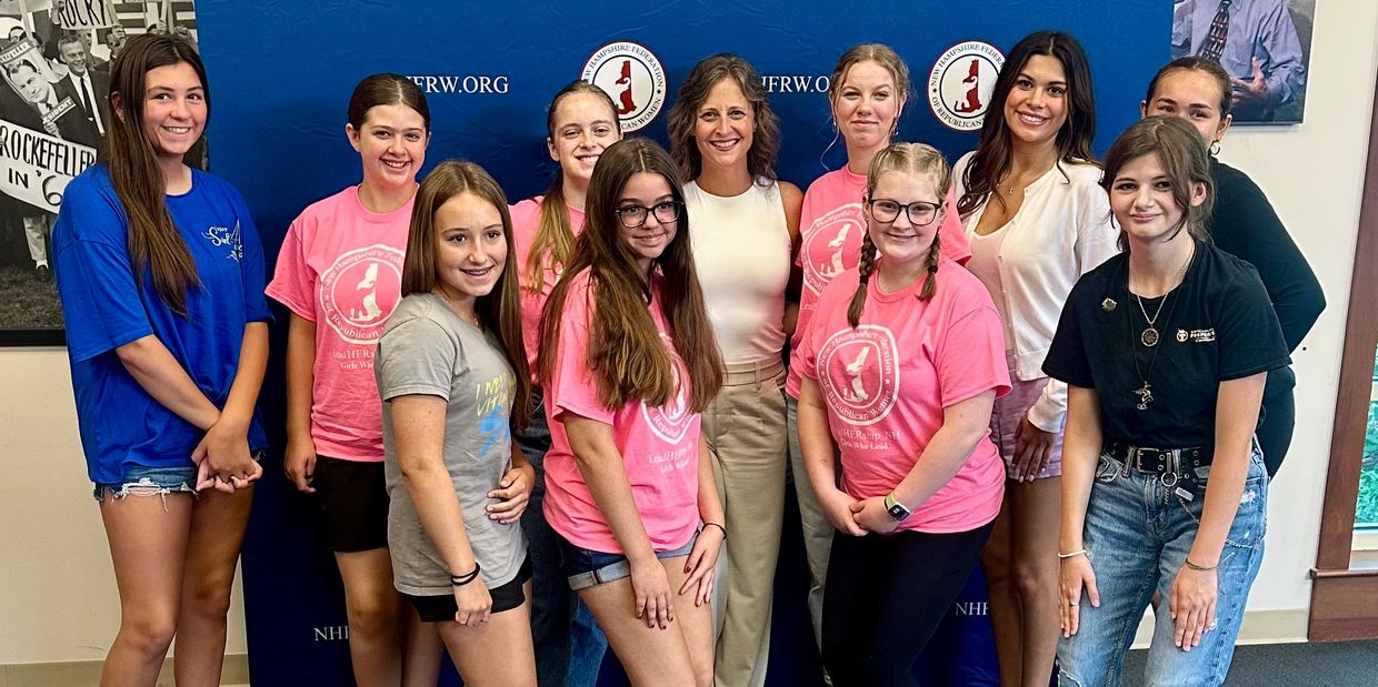 10 high school girls with educational advocate standing in the middle